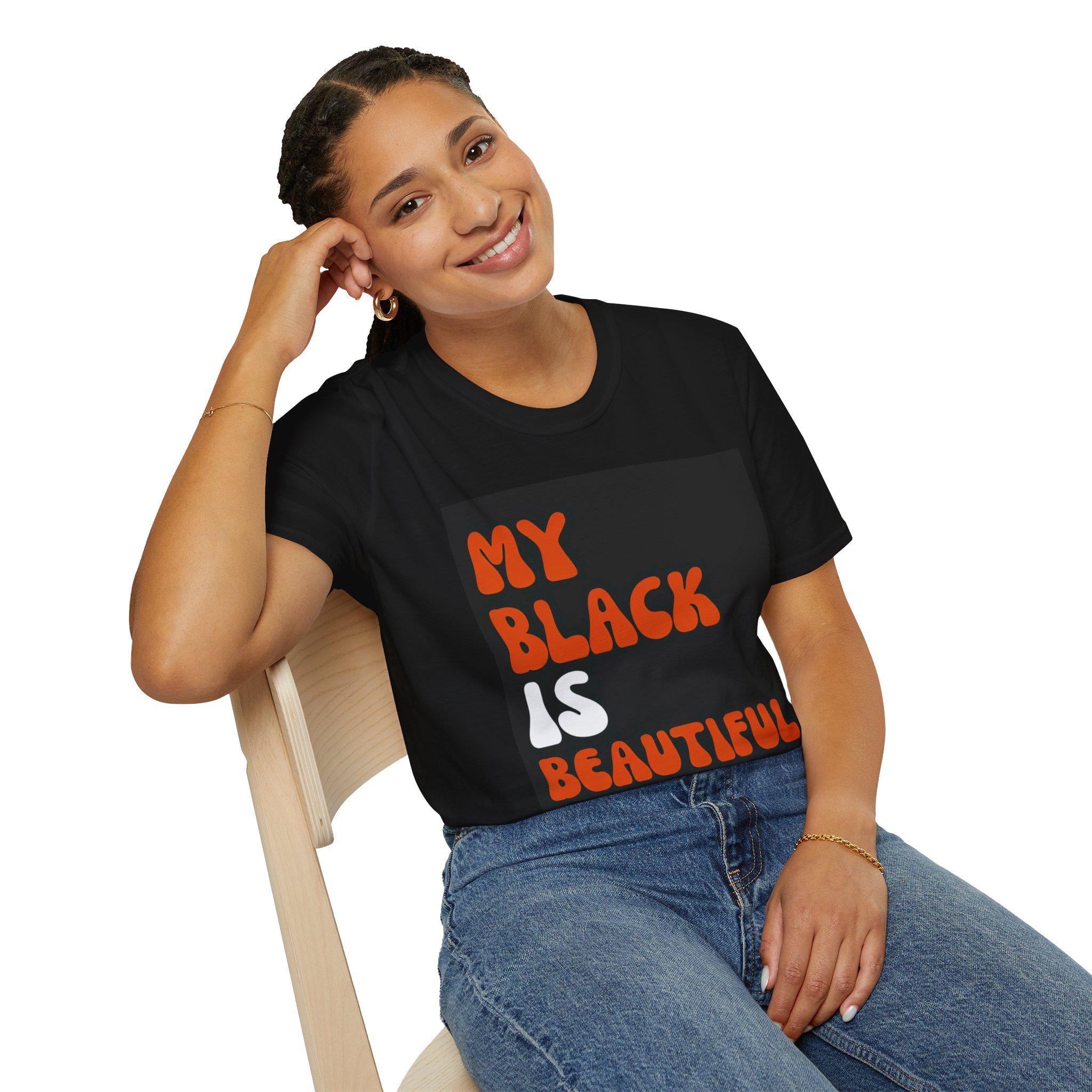 May include: A black t-shirt with the text 'My Black Is Beautiful' printed in orange and white letters.